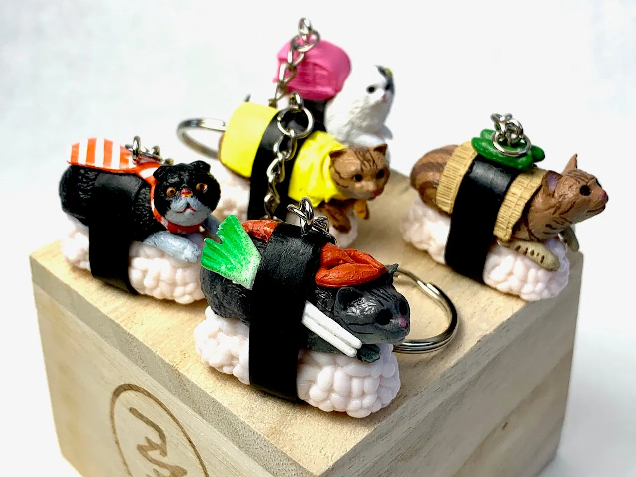 X 12050 SUSHI CAT KEY CHARM-DISCONTINUED