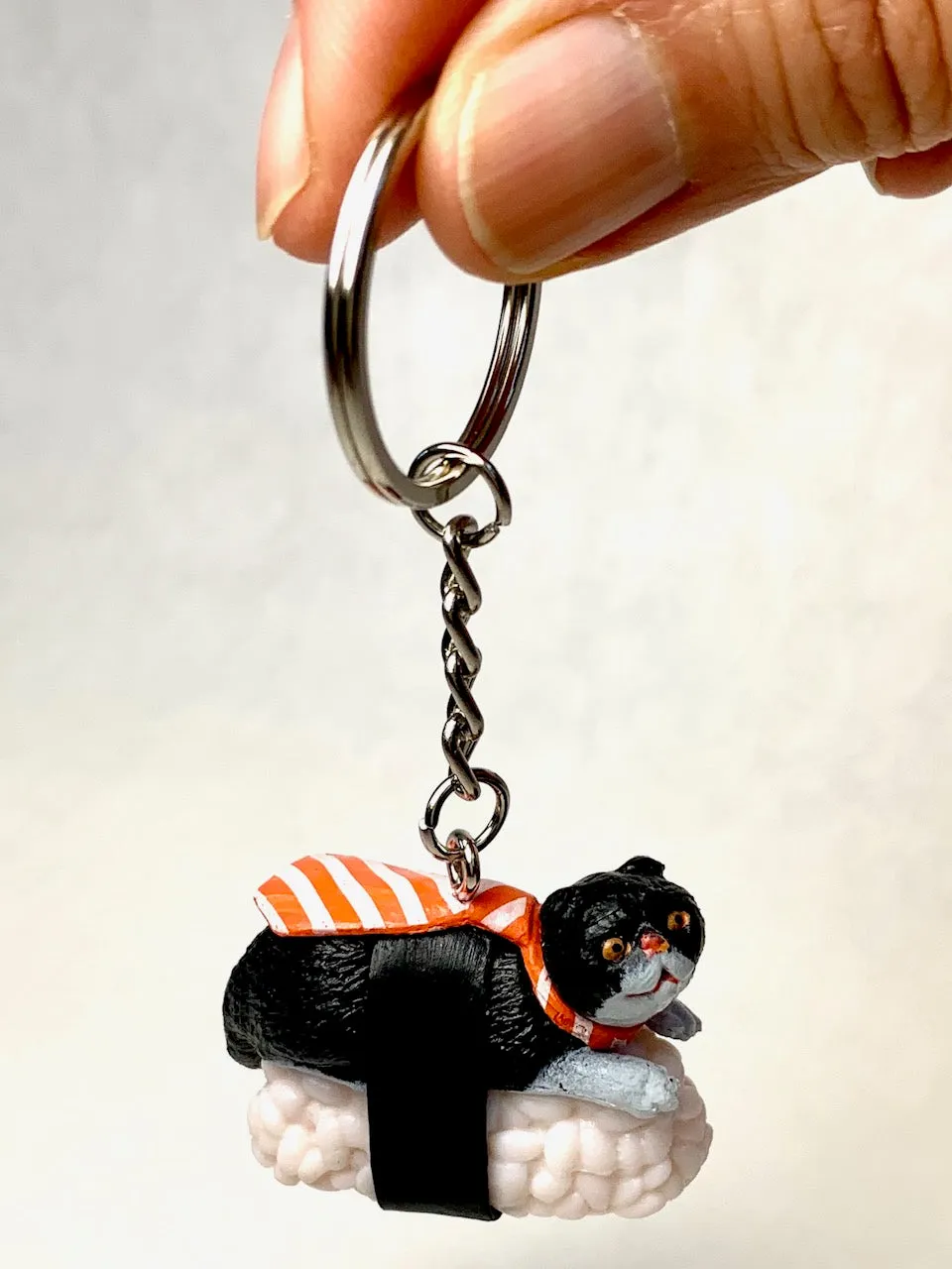 X 12050 SUSHI CAT KEY CHARM-DISCONTINUED